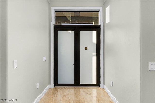 entrance foyer with light hardwood / wood-style flooring