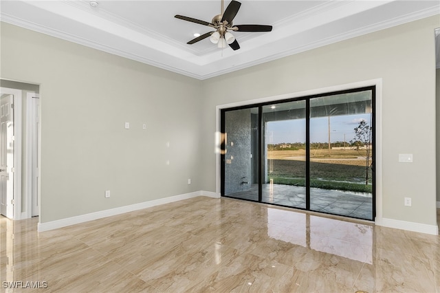 unfurnished room featuring a raised ceiling, ceiling fan, and crown molding