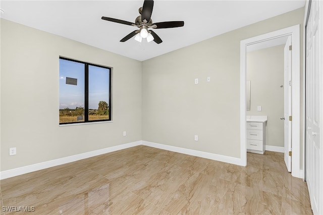 unfurnished room with ceiling fan