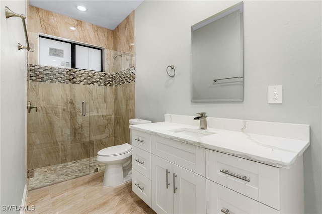 bathroom with walk in shower, vanity, toilet, and hardwood / wood-style flooring