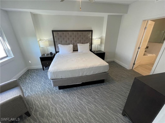 14501 Grove Resort Ave Unit 3712, Winter Garden, FL 34787 - bedroom with carpet floors, baseboards, and connected bathroom