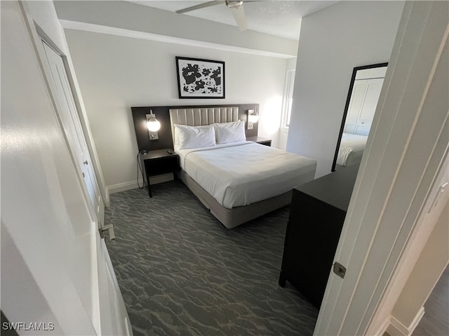 carpeted bedroom featuring ceiling fan