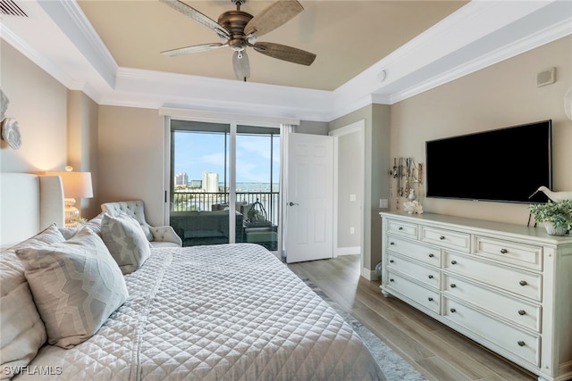 bedroom featuring ceiling fan, access to exterior, ornamental molding, and light hardwood / wood-style flooring