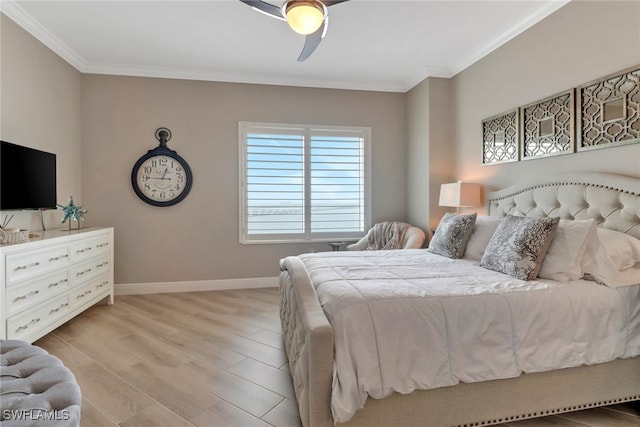 bedroom with light hardwood / wood-style floors, ceiling fan, and ornamental molding