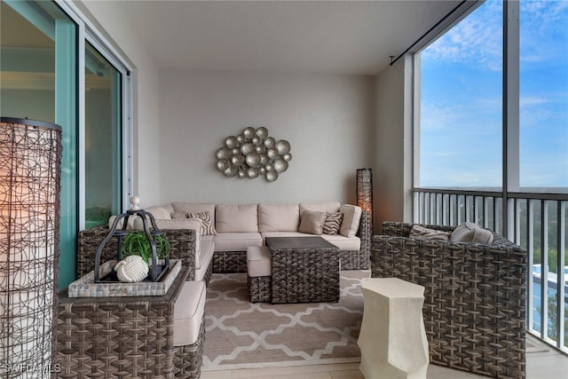 living room featuring floor to ceiling windows