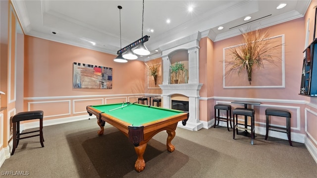 game room with carpet flooring, a large fireplace, and ornamental molding