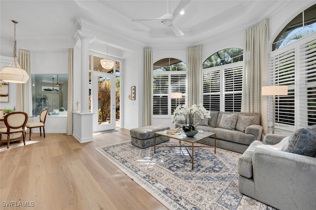 living room with ceiling fan, ornamental molding, coffered ceiling, and decorative columns