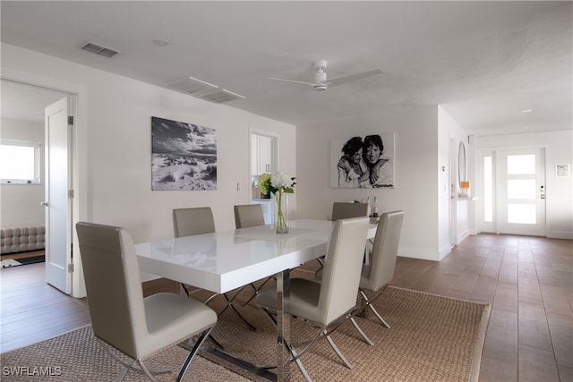 dining area featuring ceiling fan and dark hardwood / wood-style floors