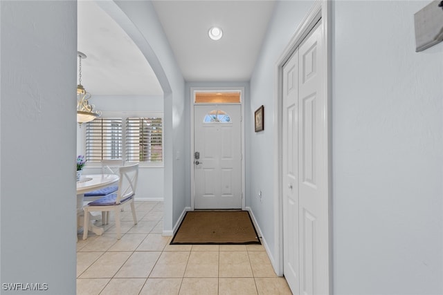 entryway with light tile patterned floors