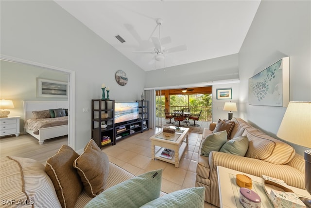 living room with ceiling fan, light tile patterned flooring, and high vaulted ceiling