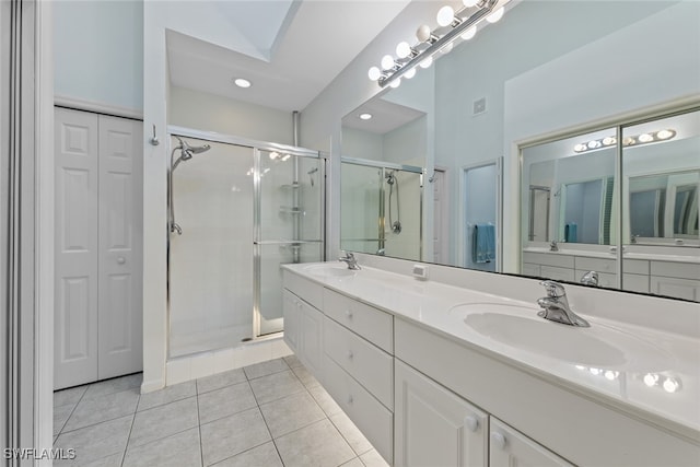 bathroom with vanity, tile patterned floors, and an enclosed shower