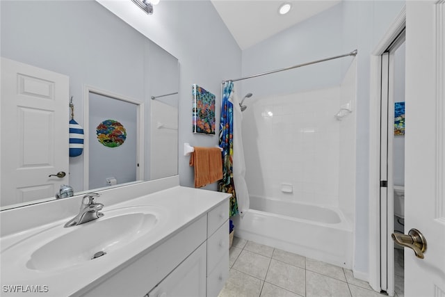 full bathroom with shower / bath combo, vanity, tile patterned floors, vaulted ceiling, and toilet