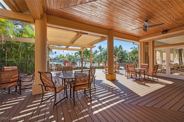 wooden terrace with ceiling fan and french doors