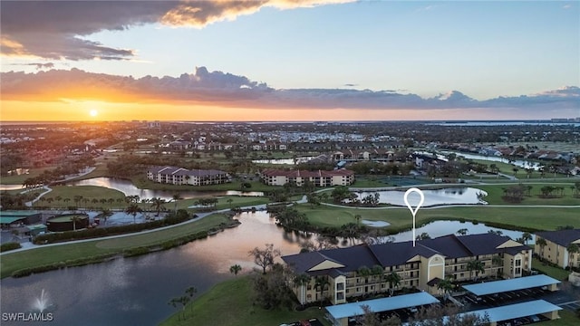 aerial view at dusk with a water view