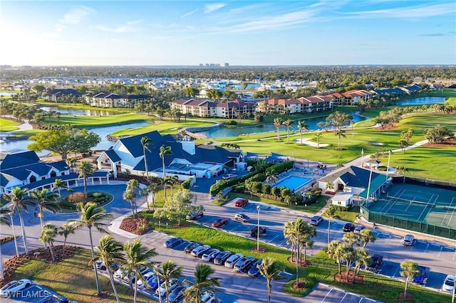 bird's eye view featuring a water view and golf course view