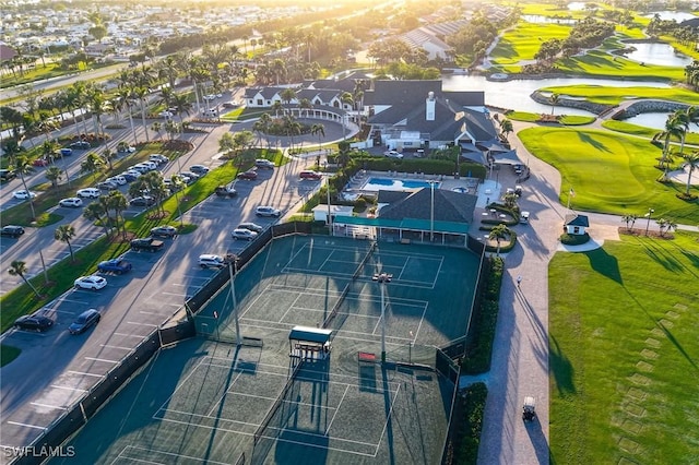 drone / aerial view with golf course view and a residential view