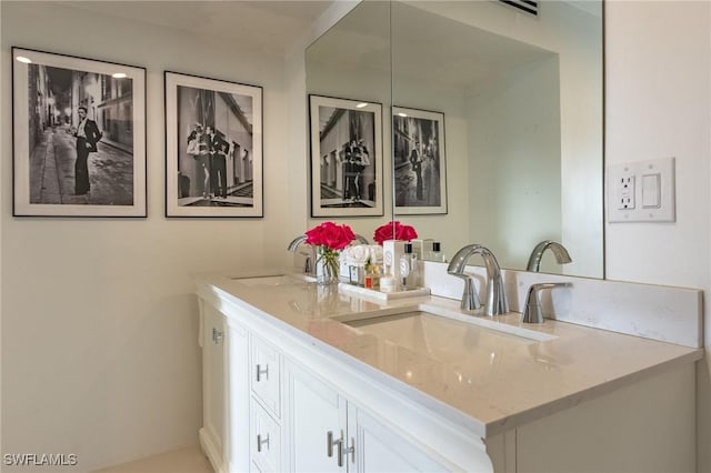 bathroom with double vanity and a sink