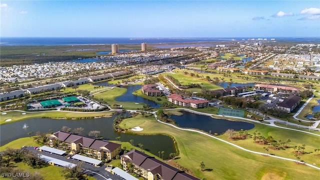 birds eye view of property featuring golf course view, a water view, and a residential view
