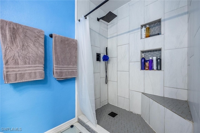 bathroom featuring tile patterned floors and walk in shower