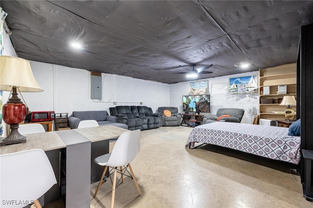 bedroom featuring electric panel and concrete flooring