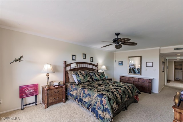 carpeted bedroom featuring ceiling fan and ornamental molding