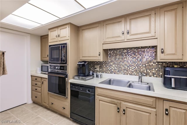 kitchen with black appliances, sink, light brown cabinetry, tasteful backsplash, and light tile patterned flooring