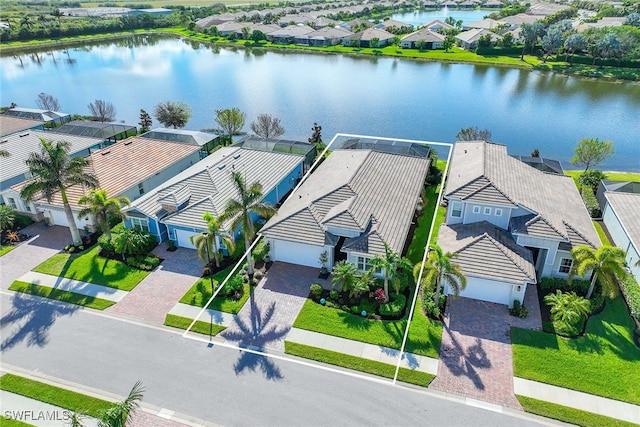 birds eye view of property with a water view