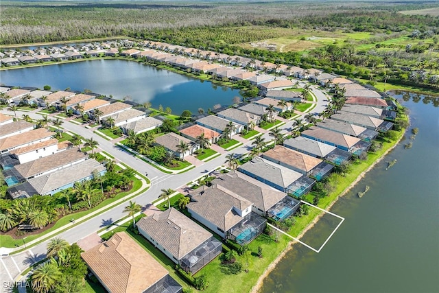 drone / aerial view featuring a water view