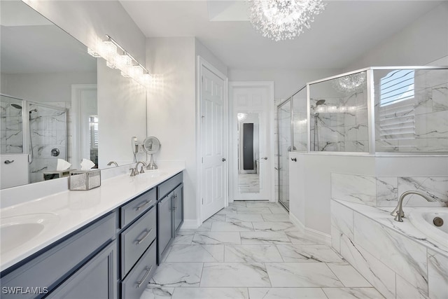 bathroom featuring a notable chandelier, vanity, and plus walk in shower