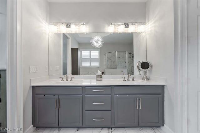 bathroom featuring a chandelier, vanity, and an enclosed shower