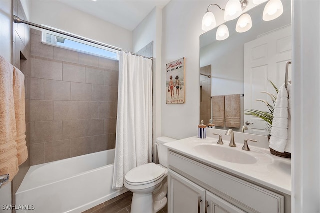 full bathroom featuring toilet, hardwood / wood-style floors, vanity, and shower / tub combo with curtain