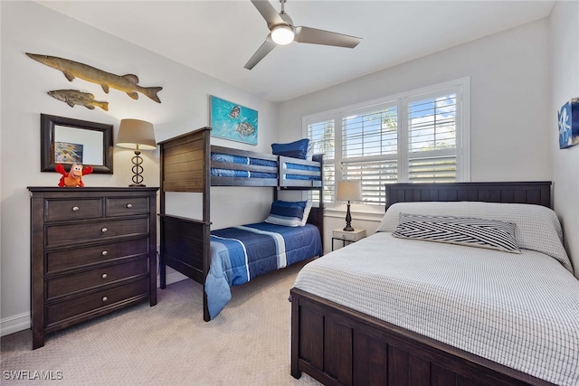 bedroom featuring light colored carpet and ceiling fan