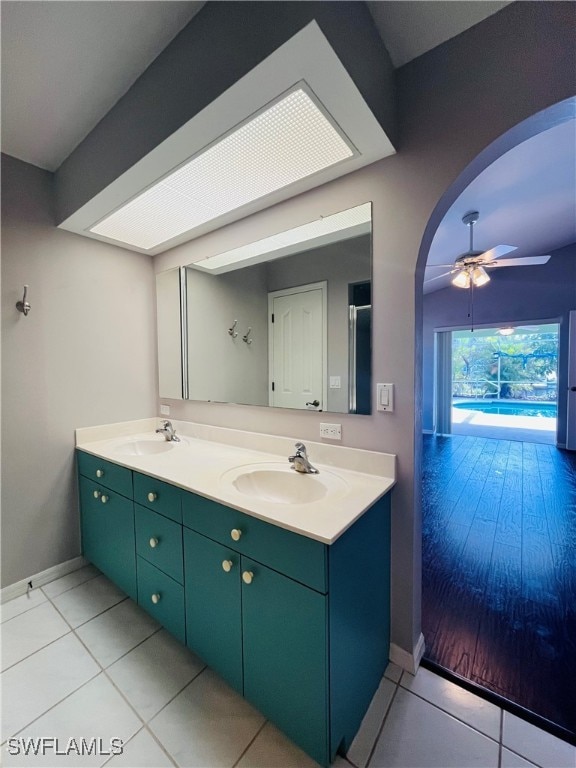 bathroom featuring vanity, tile patterned flooring, and ceiling fan