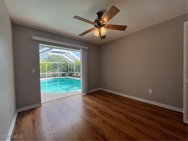 empty room featuring hardwood / wood-style flooring and ceiling fan