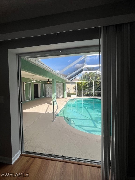 view of swimming pool with ceiling fan