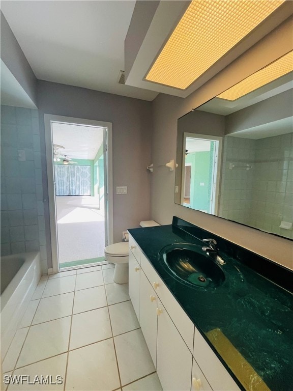 bathroom featuring tile patterned flooring, vanity, and toilet