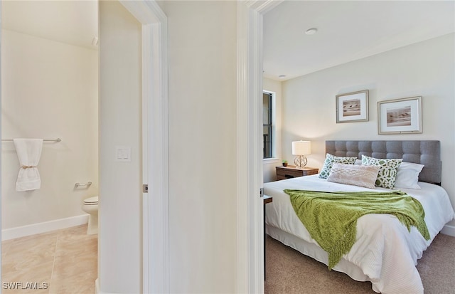 tiled bedroom with ensuite bathroom