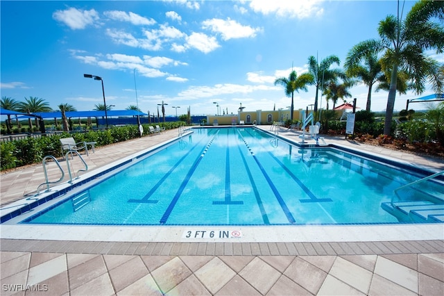 view of swimming pool featuring a patio area