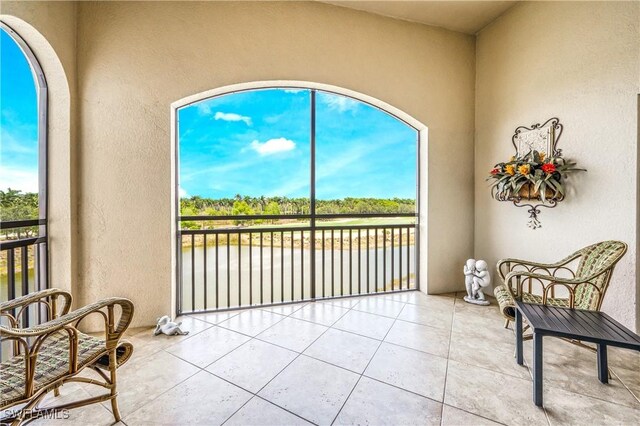 2555 Marquesa Royale Ln Unit 1-301, Naples, FL 34109 - sunroom with a water view