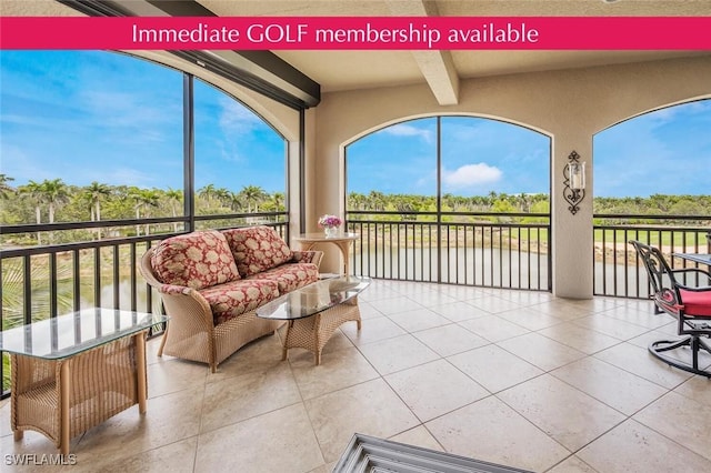 2555 Marquesa Royale Ln Unit 1-301, Naples, FL 34109 - sunroom / solarium with beam ceiling, tile patterned flooring, a water view, and view of wooded area