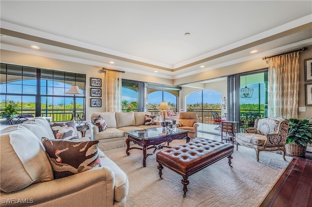 living room with wood-type flooring and crown molding