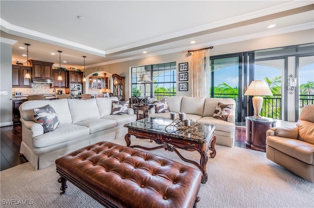 2555 Marquesa Royale Ln Unit 1-301, Naples, FL 34109 - living area with crown molding, recessed lighting, arched walkways, a tray ceiling, and light wood-style floors