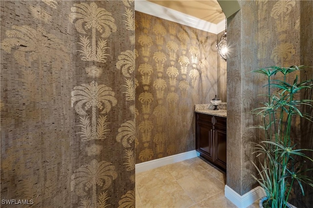 2555 Marquesa Royale Ln Unit 1-301, Naples, FL 34109 - bathroom featuring vanity and wallpapered walls