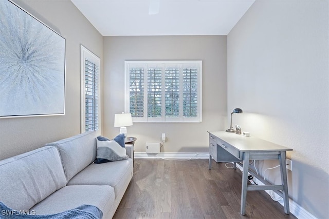 living area with hardwood / wood-style flooring