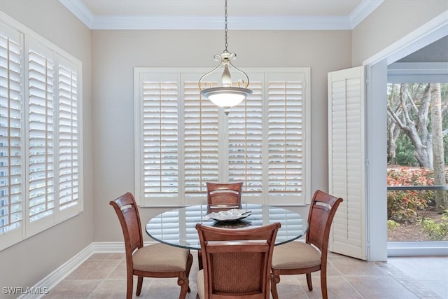 dining space featuring crown molding, light tile patterned floors, and a healthy amount of sunlight