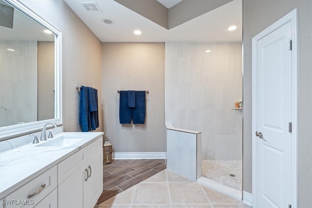 bathroom featuring vanity and walk in shower