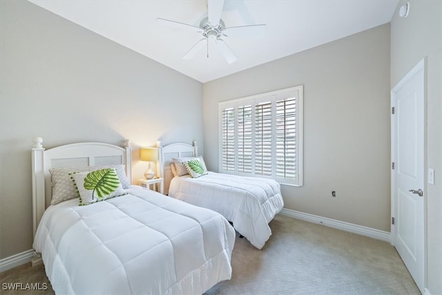 bedroom with light carpet and ceiling fan