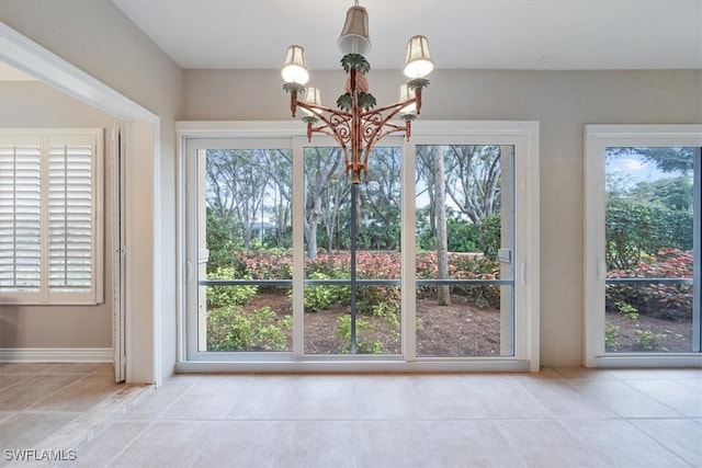 unfurnished dining area with a notable chandelier