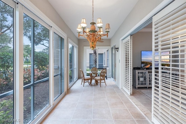 unfurnished sunroom with a notable chandelier