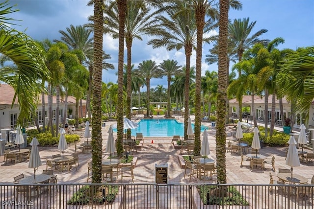 surrounding community featuring a patio and a swimming pool